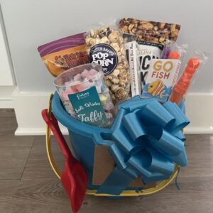 A basket with gifts, food and a blue bow